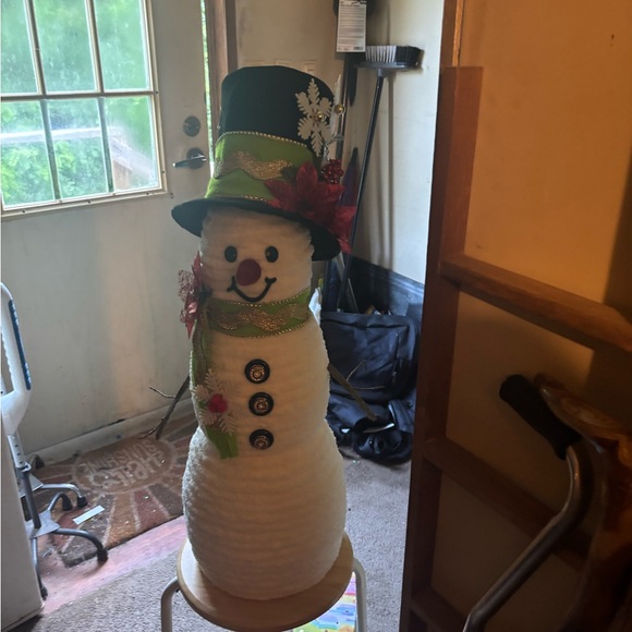 Festive Snowman Decoration with Green Hat and Red Accents